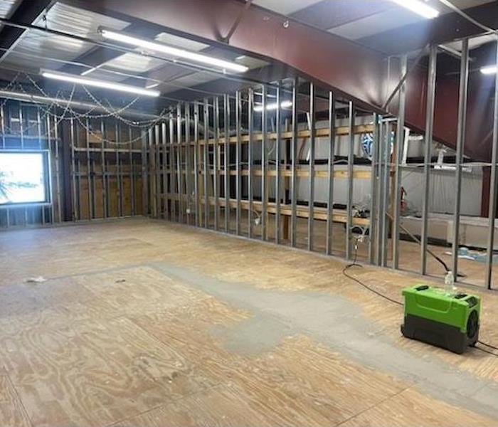 Clean, dry facility with dehumidifier after teardown of flooring and drywall. Subfloor, framing, and roof intact