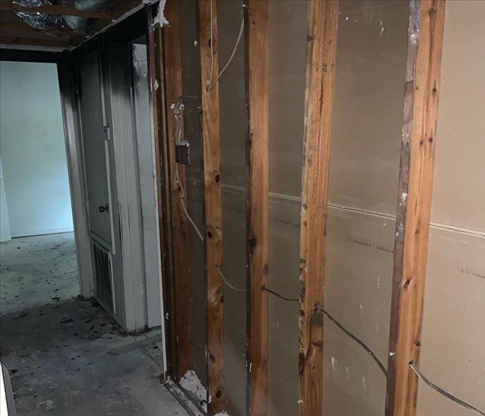 Apartment with sheetrock removed and framework exposed