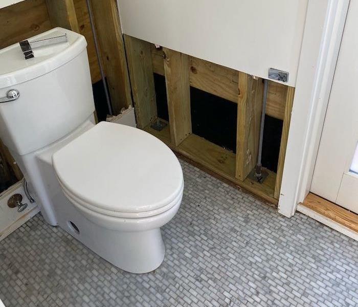  Bathroom with partial wall removed around toilet