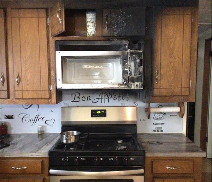 Kitchen with soot on cabinets and ceiling 
