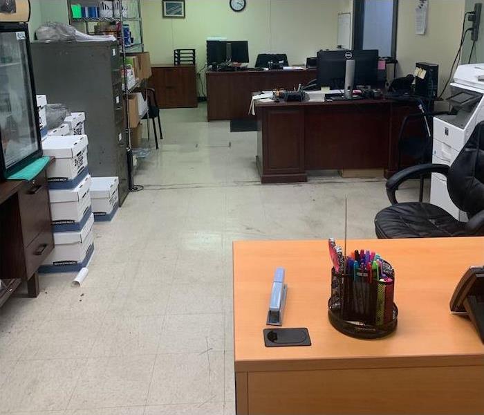 office space with white tile floor and wood desks