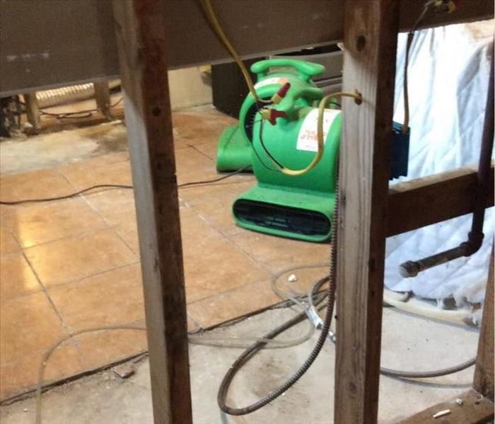 SERVPRO equipment in a room with drywall missing. 